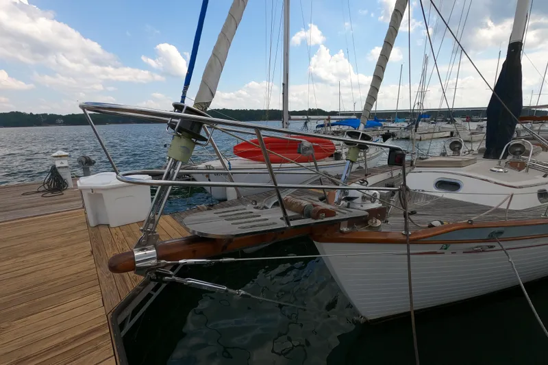 Slide: The Image of 1986 Ta Shing Baba 40 sailboat docked at a marina, showcasing its classic design. - 40