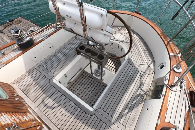 Slide: The Image of Cockpit of 1986 Ta Shing Baba 40 sailboat with wooden deck and steering wheel. - 7