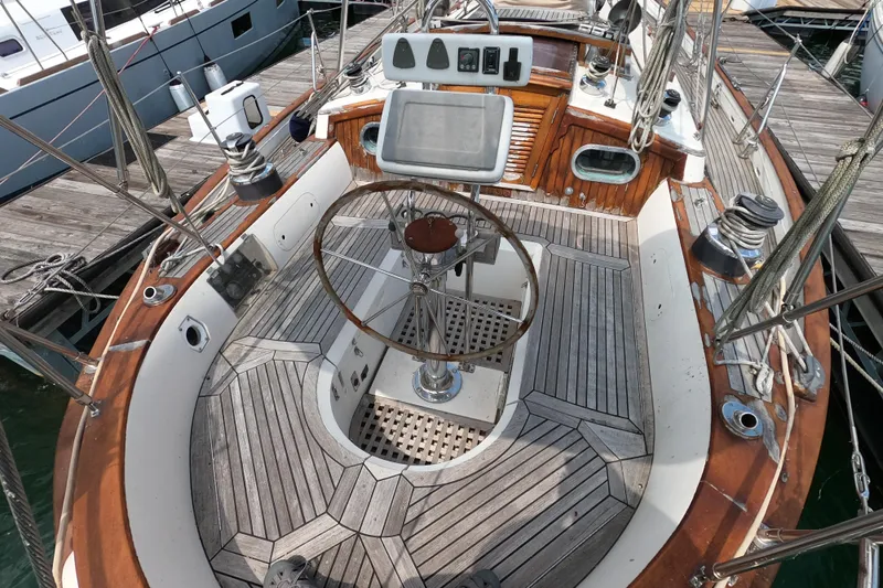 Slide: The Image of Cockpit of a 1986 Ta Shing Baba 40 sailboat with wooden deck and steering wheel. - 8