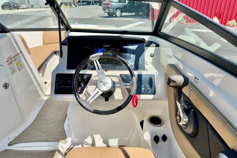 Slide: The Image of 2022 Sea Ray SPX 210 Outboard boat cockpit with steering wheel and control panel. - 14