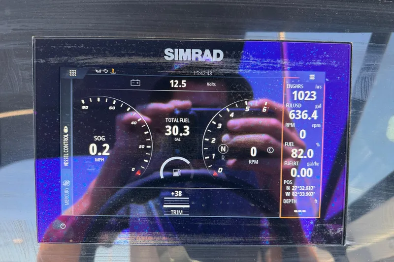 Slide: The Image of Simrad display on 2022 Sea Ray SPX 210 Outboard showing fuel and engine data. - 16