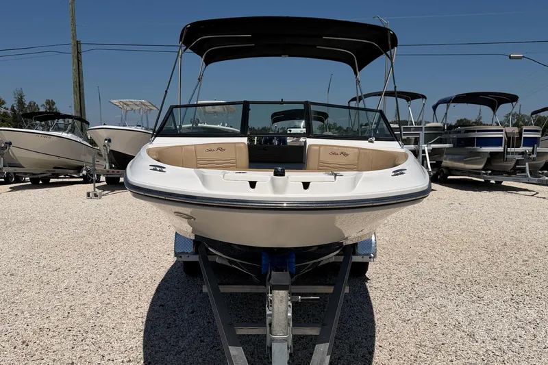 Slide: The Image of 2022 Sea Ray SPX 210 Outboard boat on trailer, displayed in a sunny outdoor setting. - 2