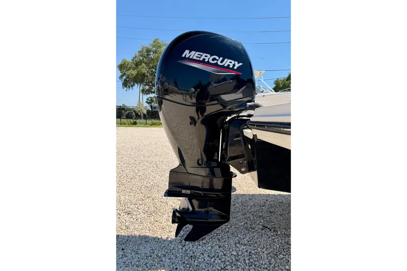 Slide: The Image of 2022 Sea Ray SPX 210 Outboard with Mercury engine, parked on gravel. - 30