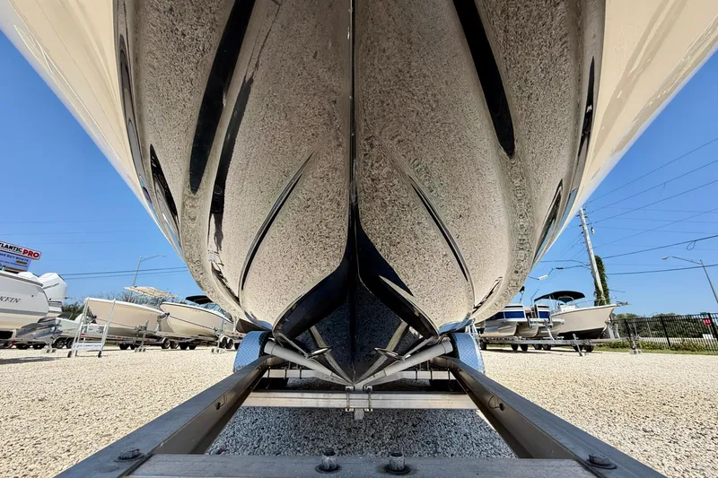 Slide: The Image of 2022 Sea Ray SPX 210 Outboard boat hull on trailer, viewed from below. - 32