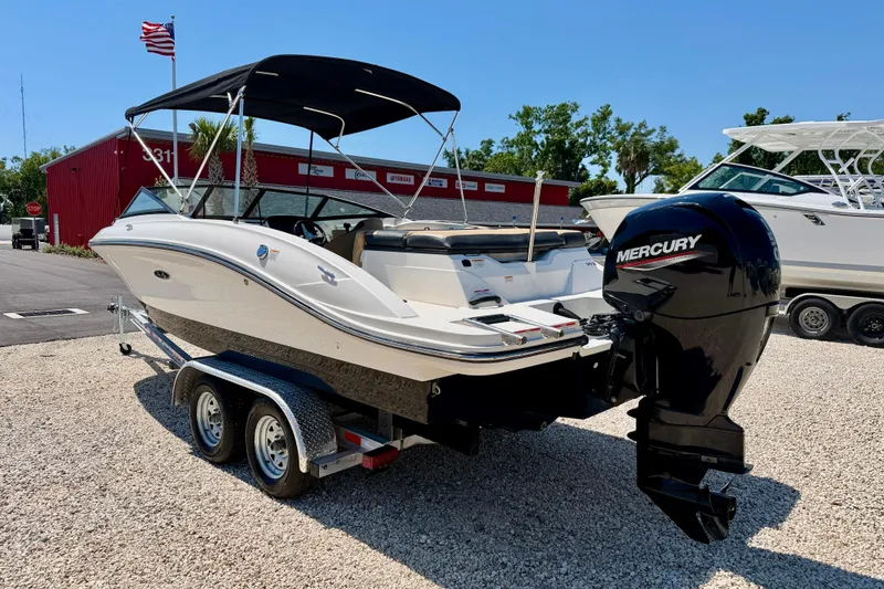 Slide: The Image of 2022 Sea Ray SPX 210 Outboard boat on trailer, featuring a Mercury engine. - 5