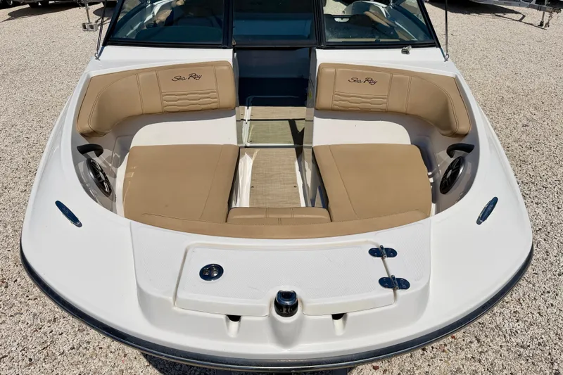 Slide: The Image of 2022 Sea Ray SPX 210 Outboard boat with tan seating and spacious bow area. - 8