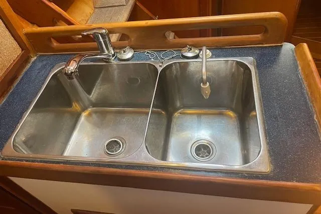 Slide: The Image of Double stainless steel sink in a 2001 Tartan 3700 yacht kitchen. - 12