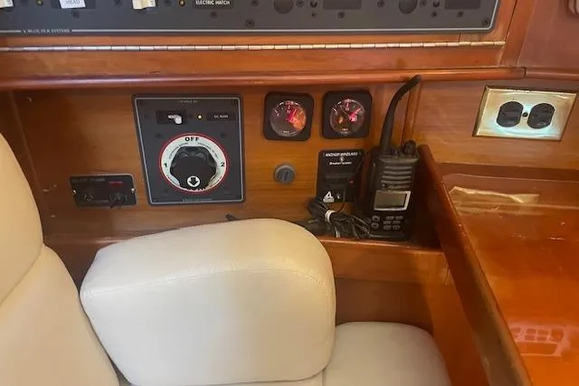 Slide: The Image of Control panel of a 2001 Tartan 3700 yacht with gauges and radio equipment. - 14