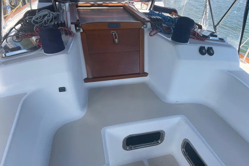 Slide: The Image of Cockpit of 2001 Tartan 3700 sailboat with ropes and wooden hatch. - 26