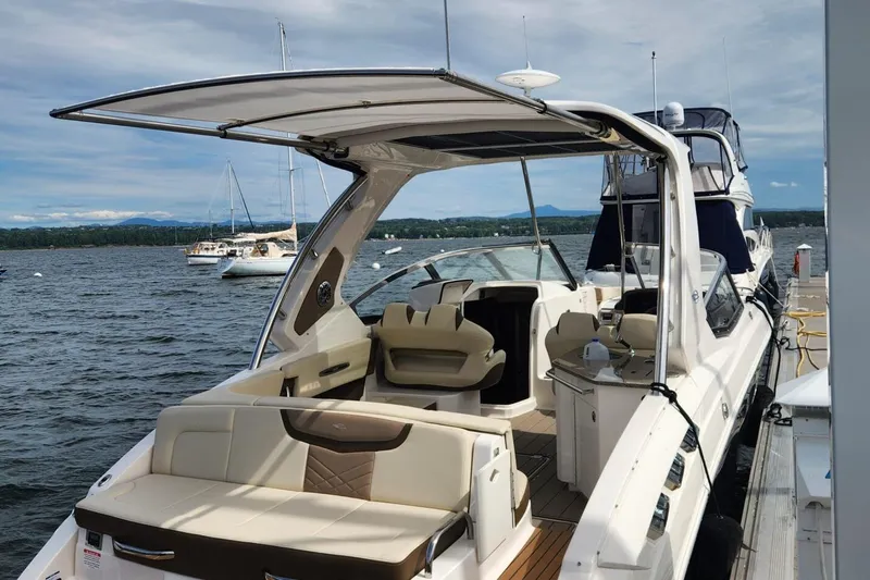 Slide: The Image of 2023 Chaparral 347 SSX luxury boat docked, featuring spacious seating and sleek design. - 1