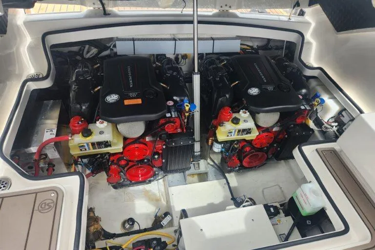 Slide: The Image of Engine compartment of 2023 Chaparral 347 SSX boat, featuring dual powerful engines. - 14