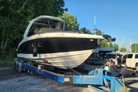 Slide: The Image of 2023 Chaparral 347 SSX boat on trailer in outdoor setting. - 16