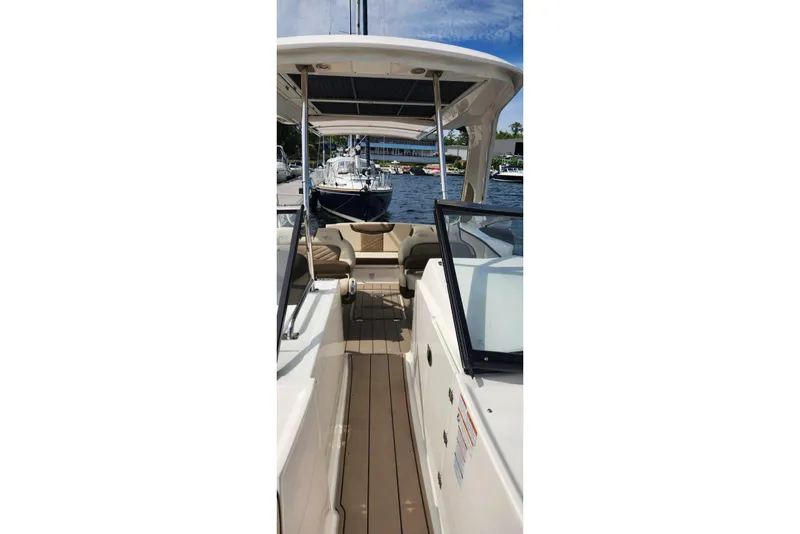 Slide: The Image of 2023 Chaparral 347 SSX boat interior with seating and open deck view. - 18