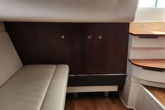 Slide: The Image of Interior of 2023 Chaparral 347 SSX boat with seating and wooden accents. - 19