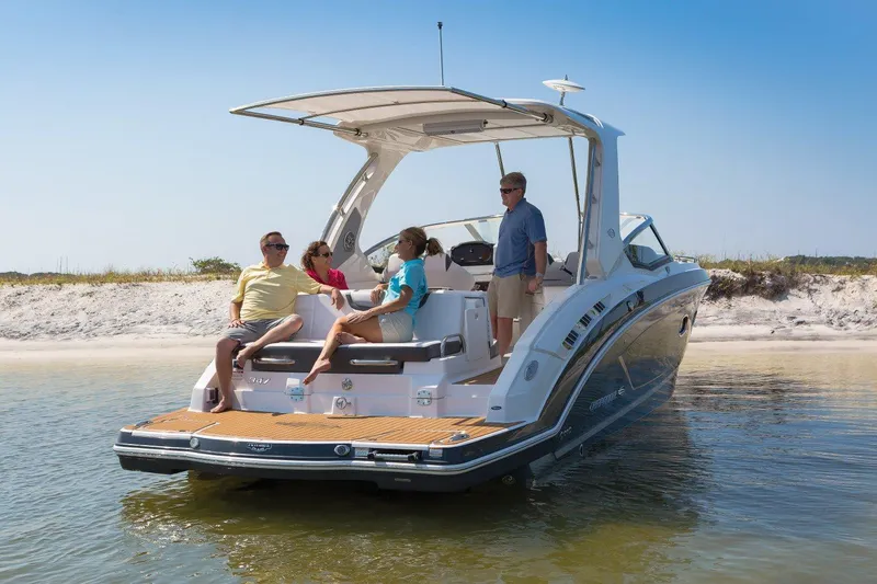 Slide: The Image of Manufacturer Provided Image: 2023 Chaparral 347 SSX boat with people relaxing on a sandy beach. - 22