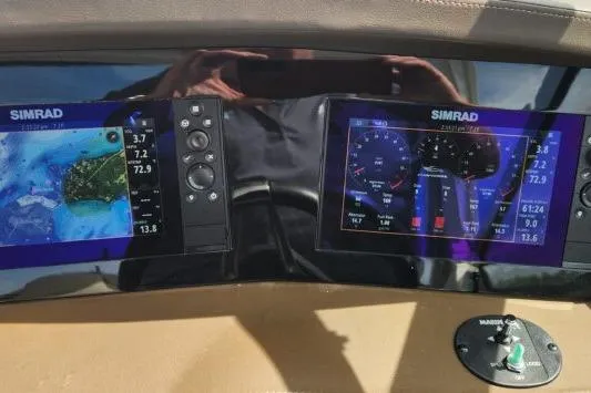 Slide: The Image of Dashboard of 2023 Chaparral 347 SSX with dual Simrad displays showing navigation and engine data. - 8