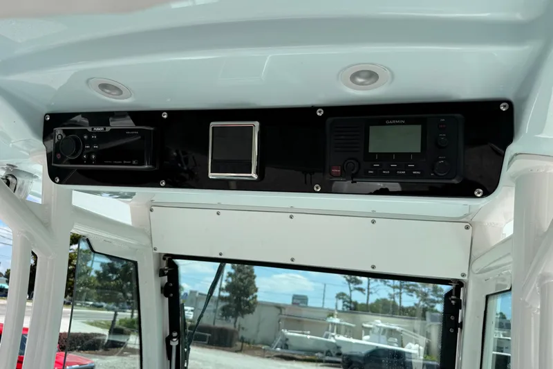 Slide: The Image of 2020 Everglades 253 Center Console dashboard with Garmin and Fusion electronics. - 4