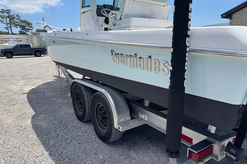 Slide: The Image of 2020 Everglades 253 Center Console boat on trailer in outdoor setting. - 6