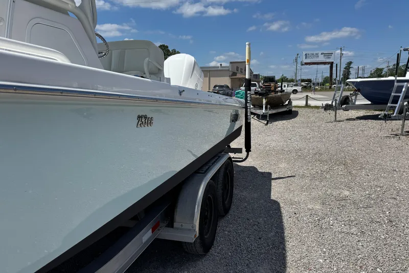 Slide: The Image of 2020 Everglades 253 Center Console boat on trailer in outdoor lot. - 7