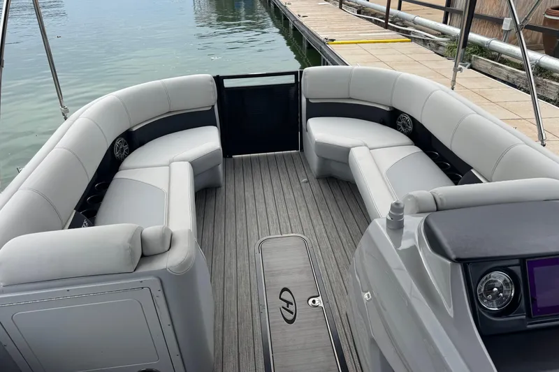 Slide: The Image of 2023 Harris Solstice 230 pontoon boat interior with gray seating and flooring. - 11