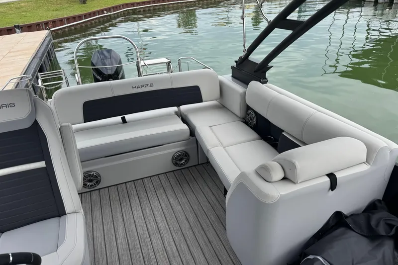Slide: The Image of 2023 Harris Solstice 230 pontoon boat interior with luxurious seating and modern design. - 13