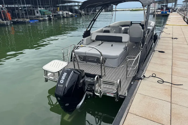 Slide: The Image of 2023 Harris Solstice 230 pontoon boat docked with Mercury 250 V8 engine. - 6