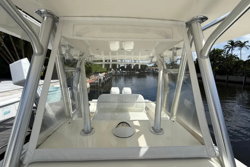 Slide: The Image of 2018 SeaVee 340Z boat interior with clear canopy and waterfront view. - 11