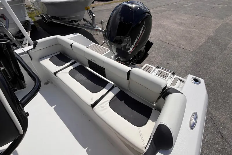 Slide: The Image of 2026 Tidewater 210 LXF boat with Mercury engine, featuring sleek seating and modern design. - 5