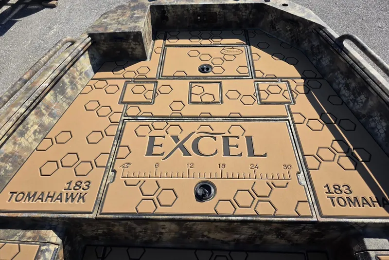 Slide: The Image of Deck of 2026 Excel 183 Tomahawk boat with hexagonal pattern and branding. - 15
