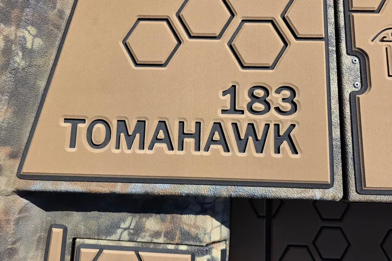 Slide: The Image of Excel 183 Tomahawk 2026 model logo with hexagonal design elements. - 16