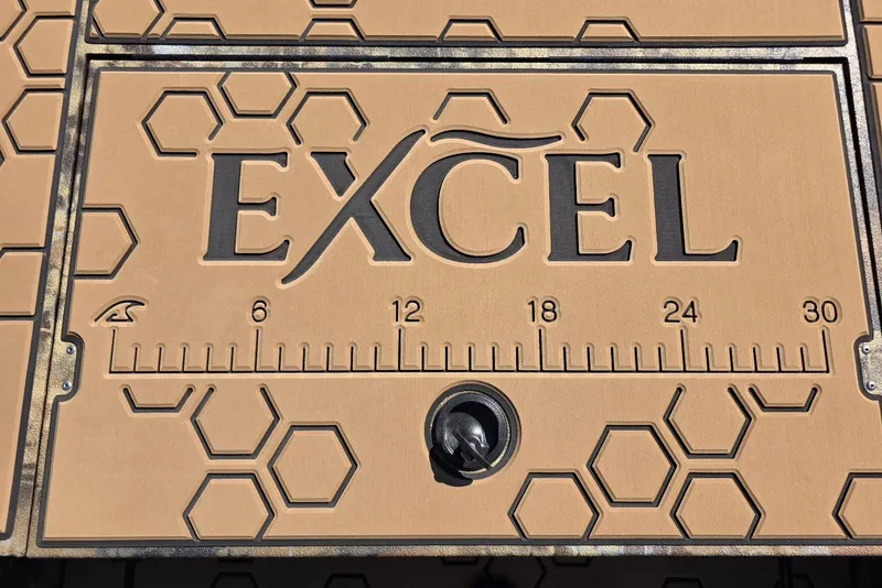 Slide: The Image of Excel 183 Tomahawk 2026 boat deck with hexagonal pattern and integrated ruler. - 17