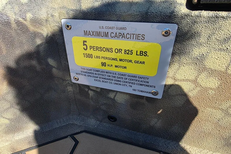 Slide: The Image of Capacity plate on Excel 183 Tomahawk boat, 2026 model, showing weight and passenger limits. - 26