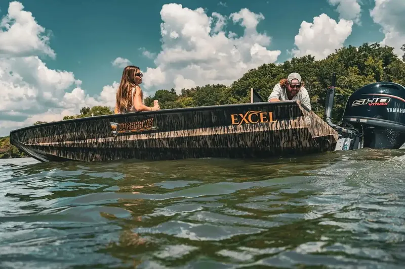 Slide: The Image of Manufacturer Provided Image: 2026 Excel 183 Tomahawk boat on water, featuring Yamaha engine, with two people onboard. - 30