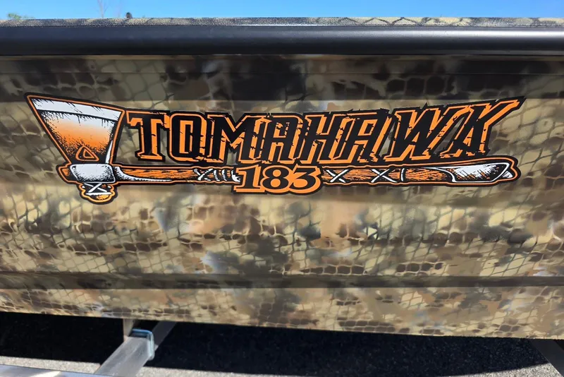 Slide: The Image of Excel 183 Tomahawk 2026 logo on camouflage background. - 4