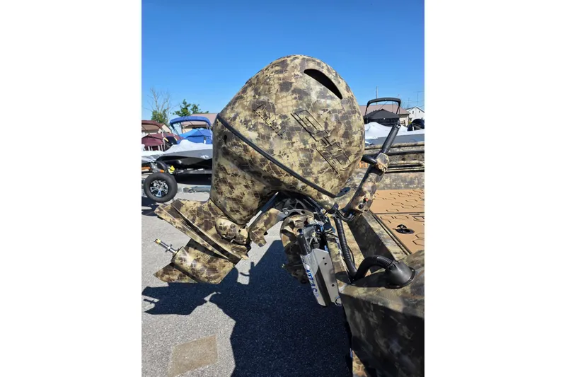 Slide: The Image of Camouflage-patterned outboard motor on Excel 183 Tomahawk boat, 2026 model. - 6