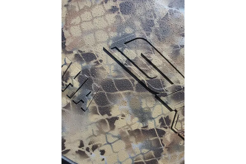 Slide: The Image of Camouflage pattern on Excel 183 Tomahawk, 2026 model, with embossed design elements. - 7