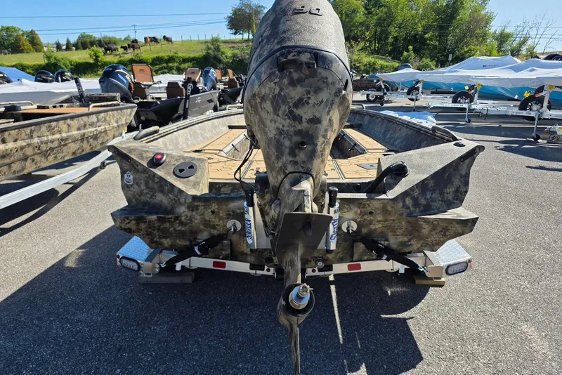 Slide: The Image of 2026 Excel 183 Tomahawk boat with camouflage design on a trailer. - 8