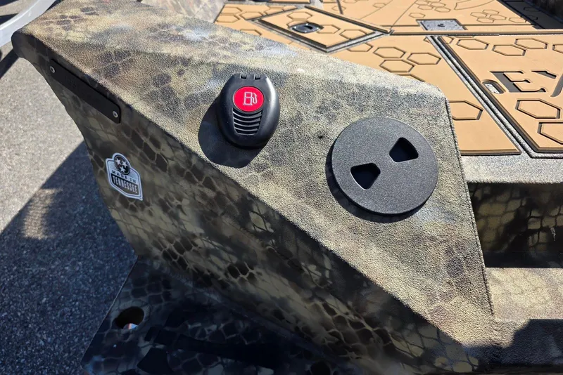 Slide: The Image of Camouflage-patterned Excel 183 Tomahawk boat detail with control buttons, 2026 model. - 9