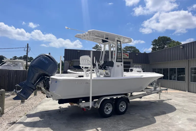 Slide: The Image of 2026 Tidewater 2210 Carolina Bay boat on trailer, featuring Yamaha outboard motor. - 1