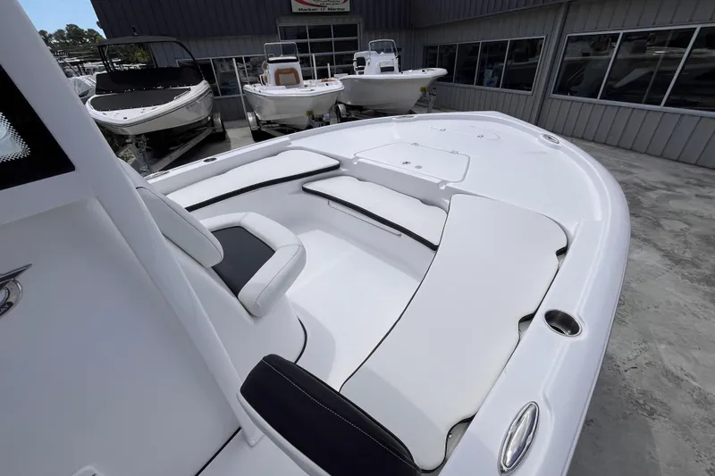 Slide: The Image of 2026 Tidewater 2210 Carolina Bay boat interior with white seating and sleek design. - 10