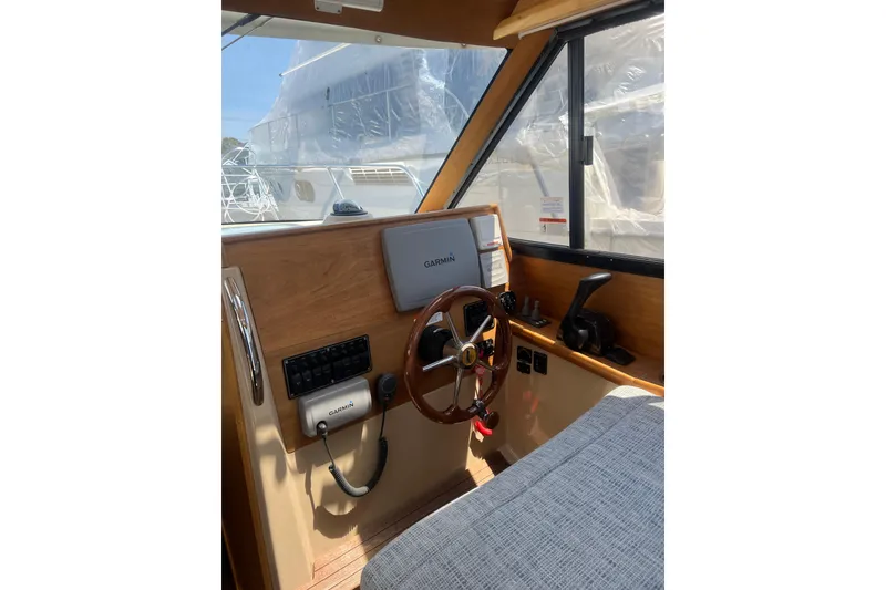 Slide: The Image of Interior helm of 2012 Cutwater 26 boat with Garmin navigation system. - 8