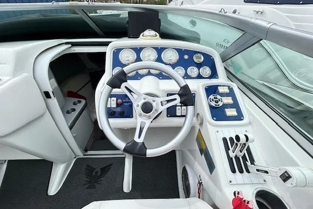 Slide: The Image of 2004 Formula 292 FASTech boat cockpit with steering wheel and instrument panel. - 10