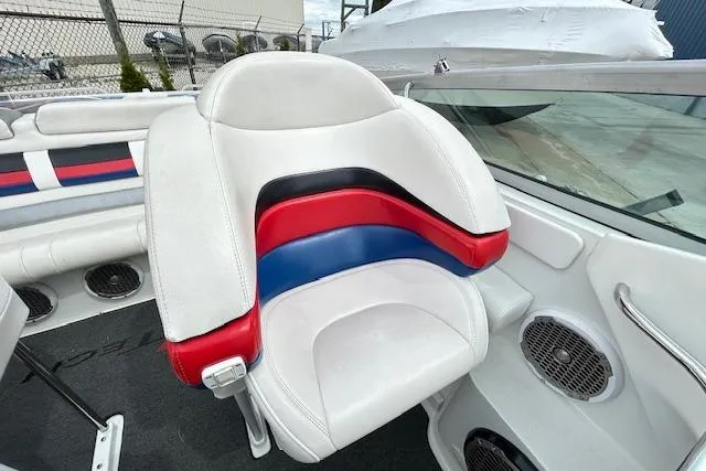 Slide: The Image of 2004 Formula 292 FASTech boat interior with white, red, and blue seating. - 12