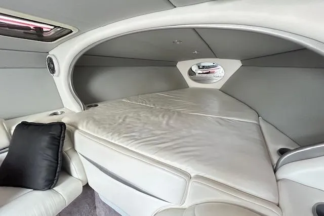 Slide: The Image of Interior cabin of a 2004 Formula 292 FASTech boat, featuring a spacious sleeping area. - 16