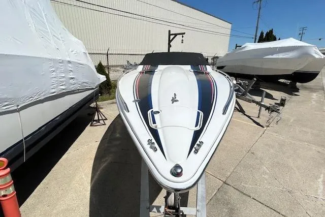 Slide: The Image of 2004 Formula 292 FASTech boat on trailer, sleek design, parked outdoors. - 3