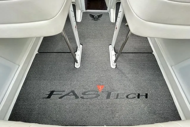 Slide: The Image of 2004 Formula 292 FASTech boat interior with branded carpet and white seating. - 9