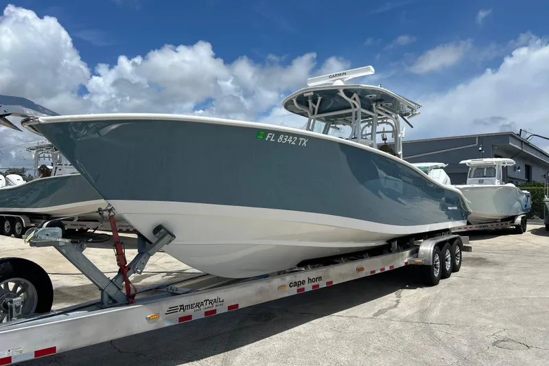 The Image of 2025 Cape Horn 34 XS boat on trailer under blue sky. - 0