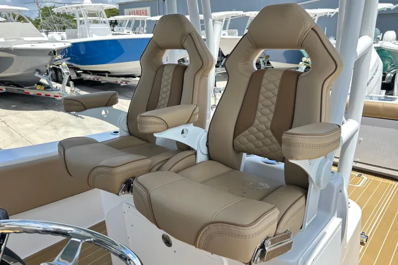 Slide: The Image of Luxury seating on 2025 Cape Horn 34 XS boat, featuring tan leather upholstery. - 11