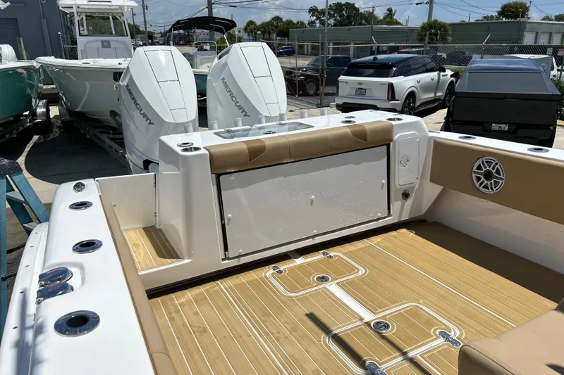 Slide: The Image of 2025 Cape Horn 34 XS boat with dual Mercury engines and teak deck. - 16
