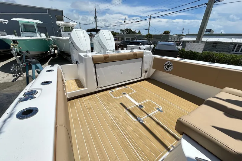 Slide: The Image of 2025 Cape Horn 34 XS boat interior with tan seating and wood-style flooring. - 17